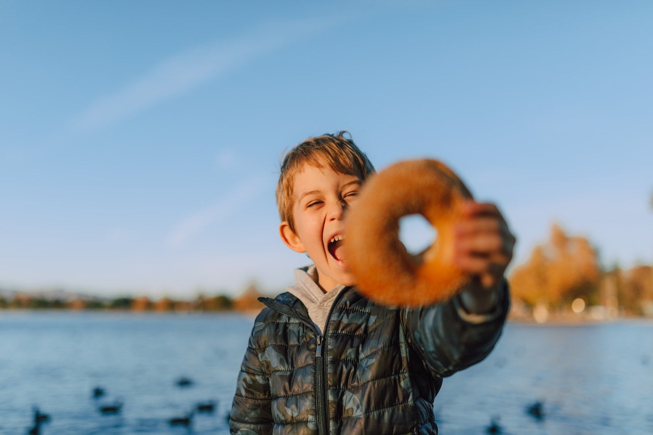 Kid Holding a donuts